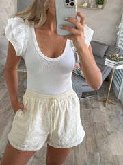 HEART PATTERN CREAM SHORTS